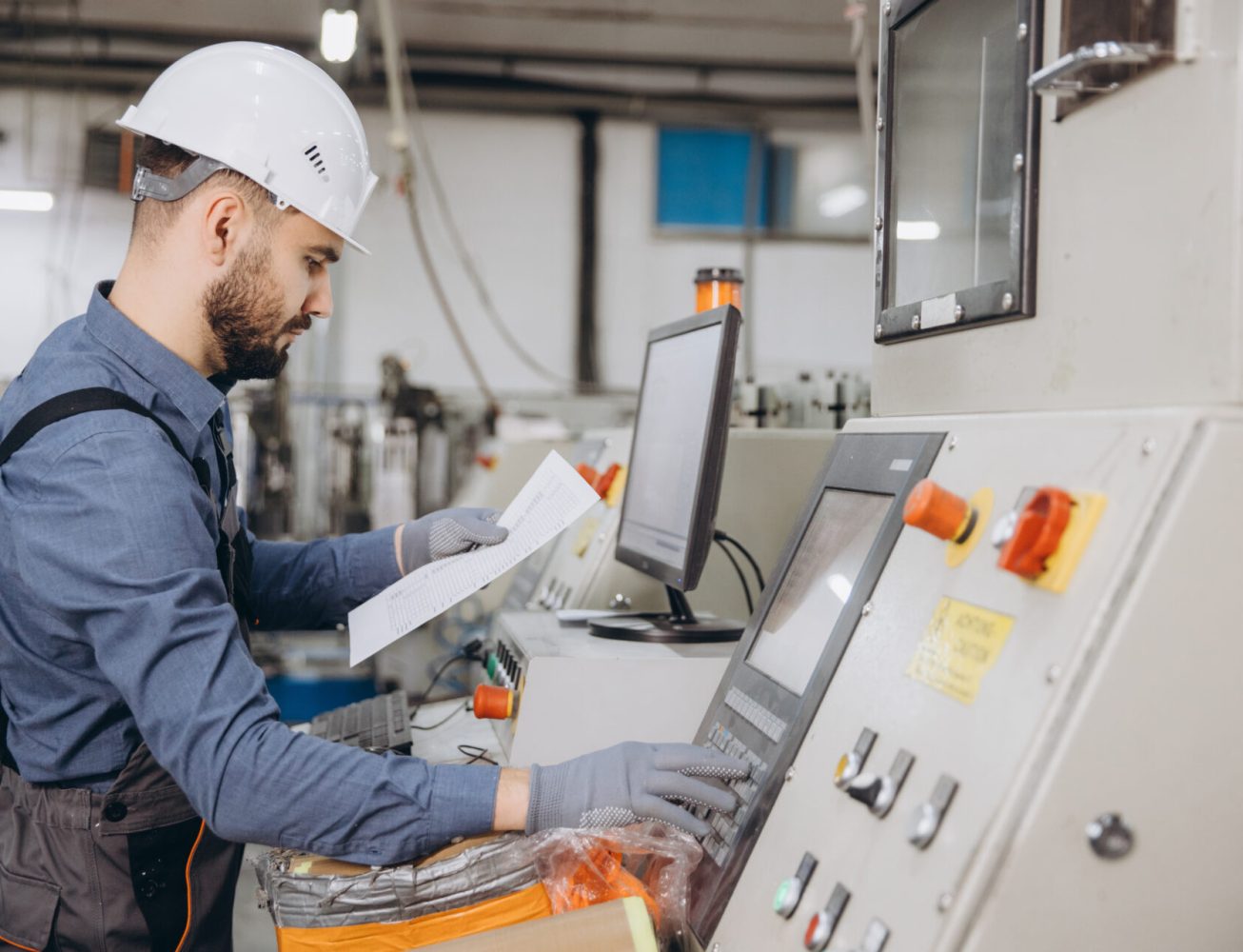 Technician operating an industrial machine
